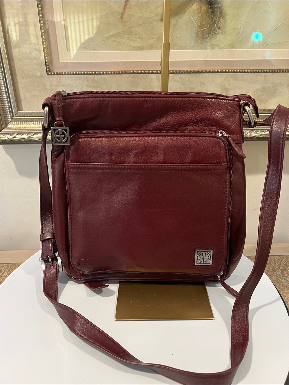 Gianni Bernini Burgundy Leather Crossbody with Front Pocket and Logo Charm